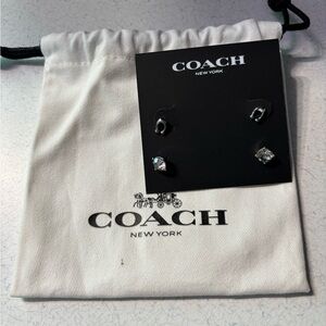 Coach Silver and Black Stud Earrings. Comes with Coach bag. Never Worn!